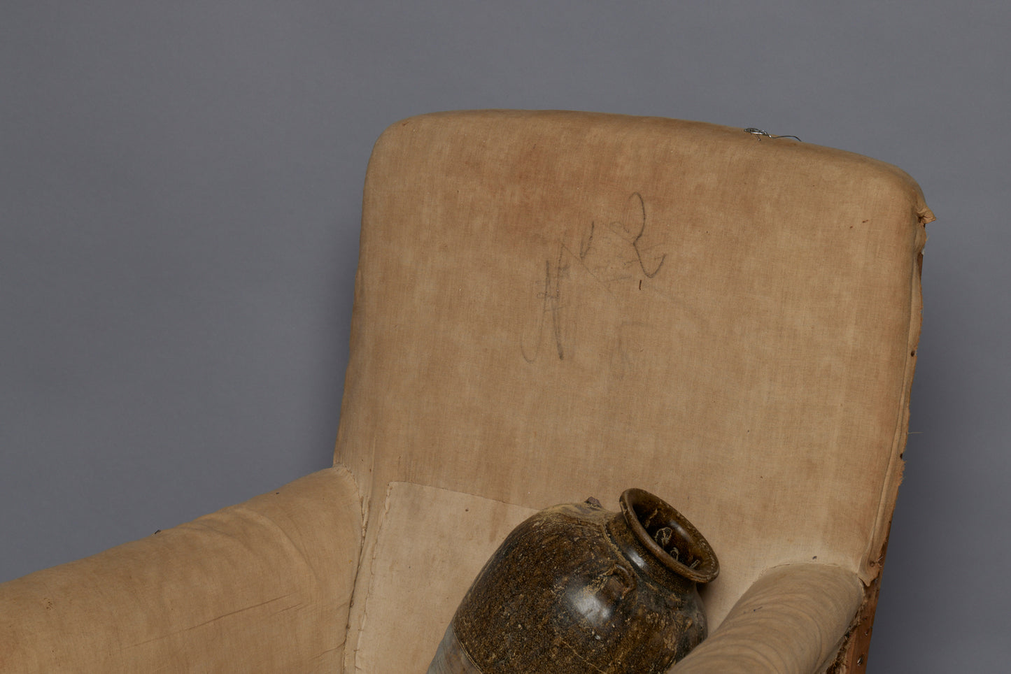 Edwardian Upholstered Armchair with Slightly Flared Arms & Rounded Shoulders