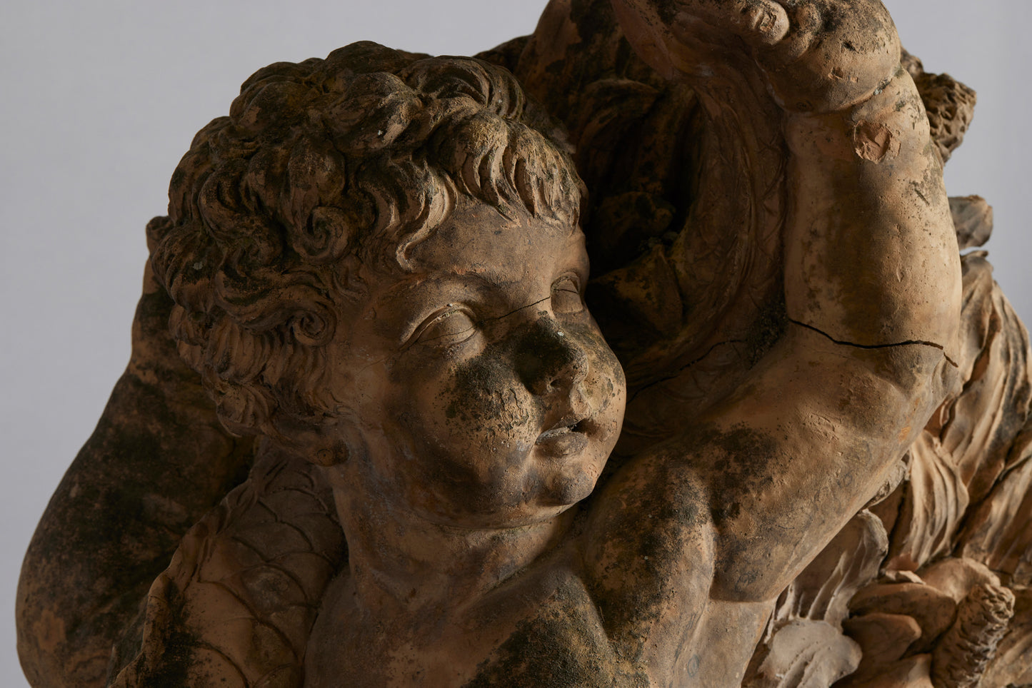 Mid to Late 18th Century Terra Cotta Fountainhead of a Putti Riding a Dolphin