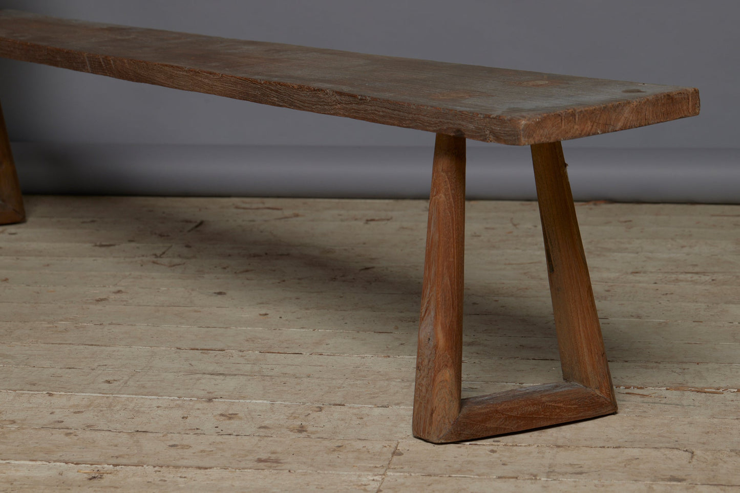 A Wide Top Splayed Leg Early Teak Bench with Beautiful Butterfly Repairs to the Top and a Round Tapered Leg - detail