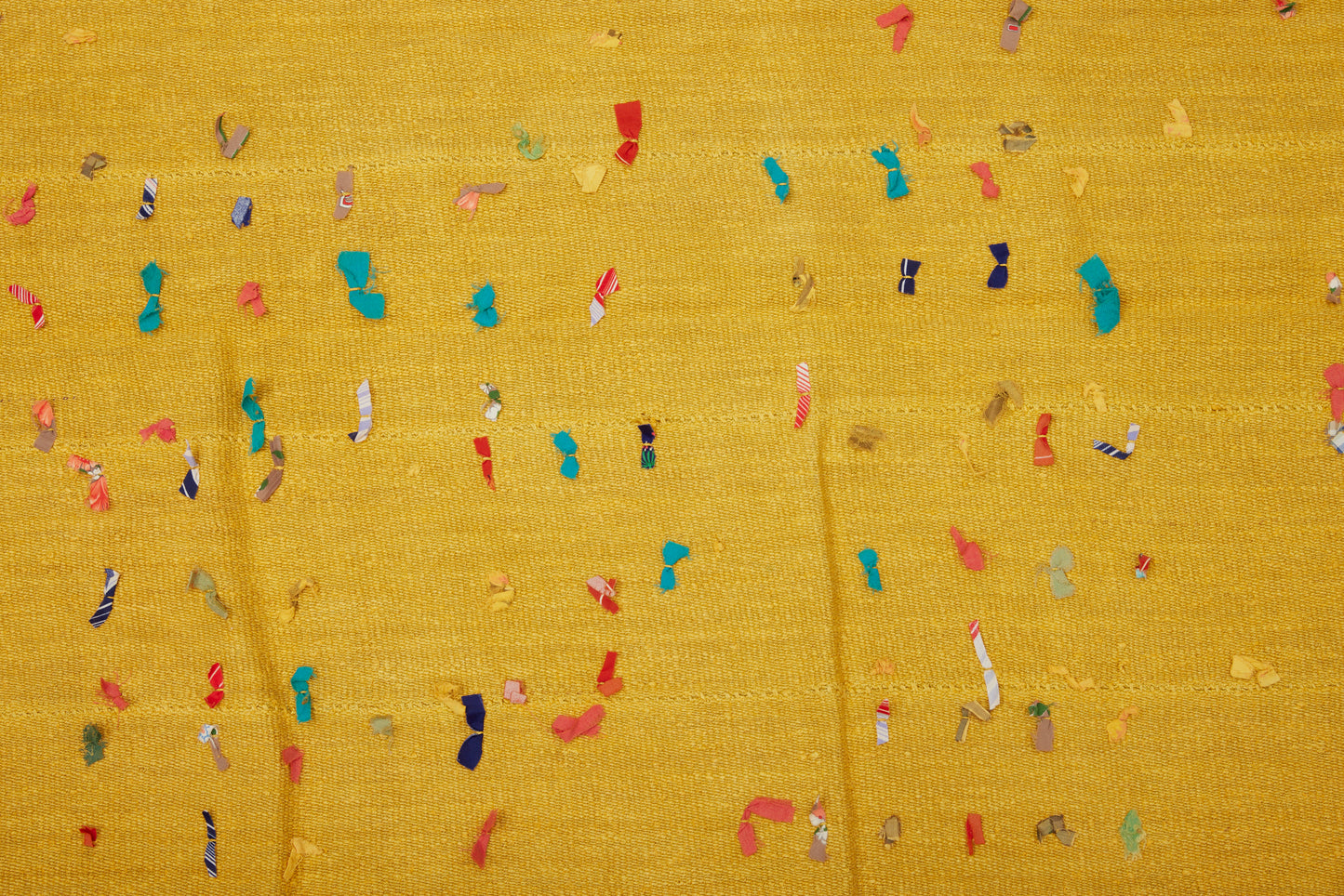 Squarish Saffron Colored Wall Hanging with an Old Patched Repair and Decorative Ribbon Decorations (5' 6" x 5' 8")