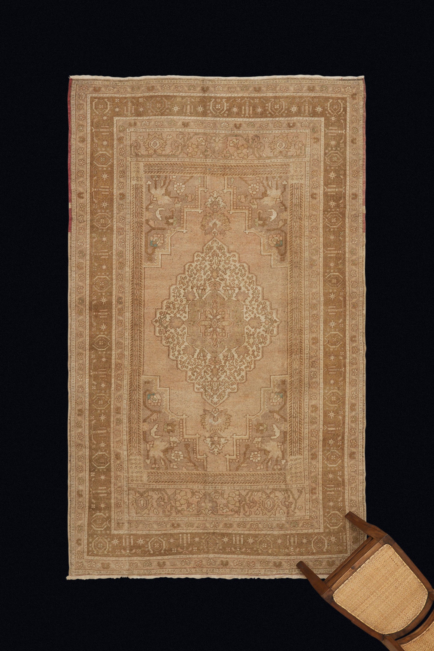 Central Anatolian Carpet with a Central Medallion with Pale Creams and Tans (5' 4" x 9' 7")