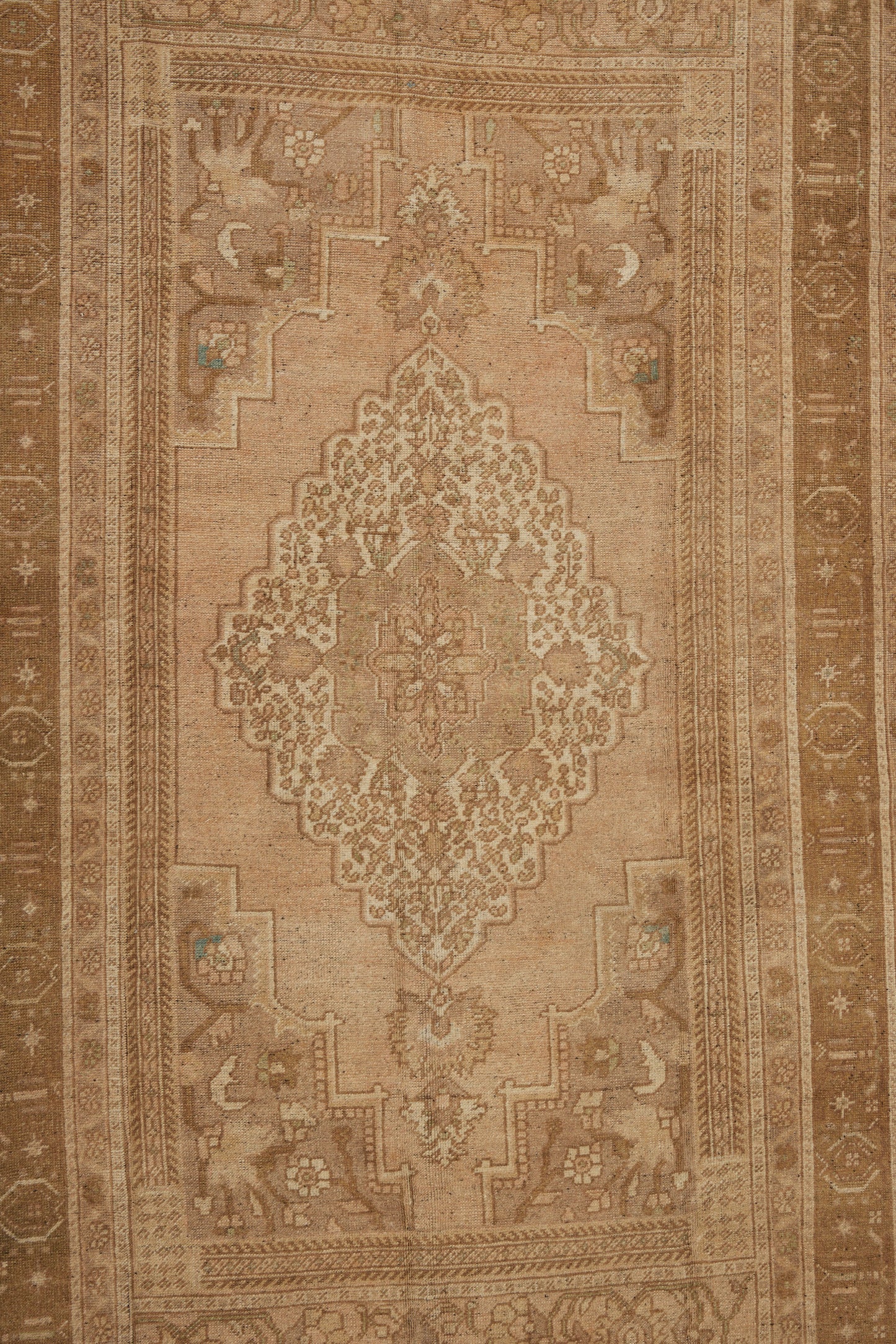 Central Anatolian Carpet with a Central Medallion with Pale Creams and Tans (5' 4" x 9' 7")