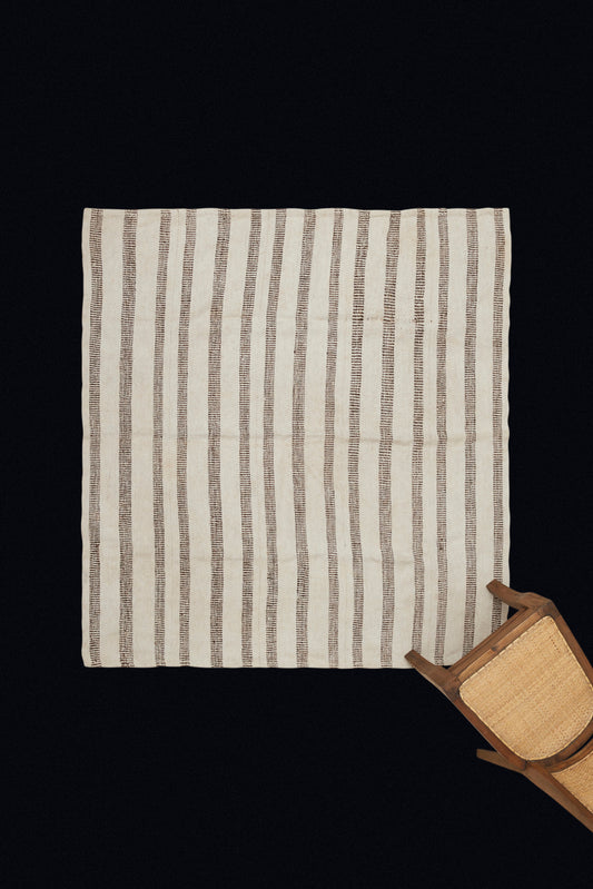 Early 20th Century Kurdish Cream Colored Hemp Carpet with Pale Brown Interrupted Stripes (5' 3" x 6' 7")
