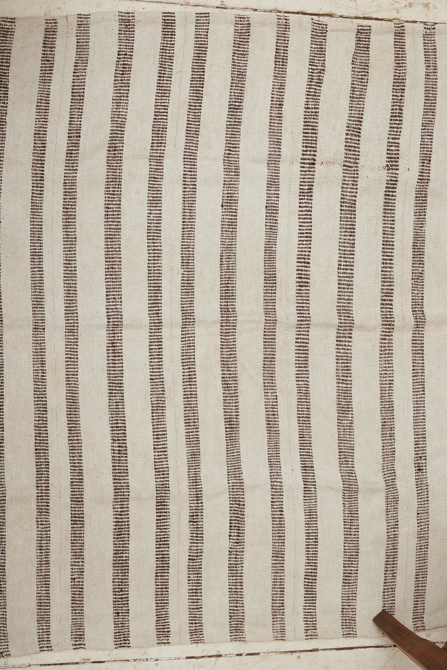 Early 20th Century Kurdish Cream Colored Hemp Carpet with Pale Brown Interrupted Stripes (5' 3" x 6' 7")