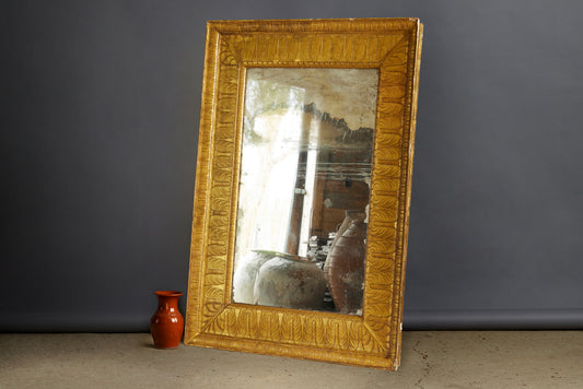 Large Egyptianesque 19th Century French Mirror with a Carved Wide Gilt Frame