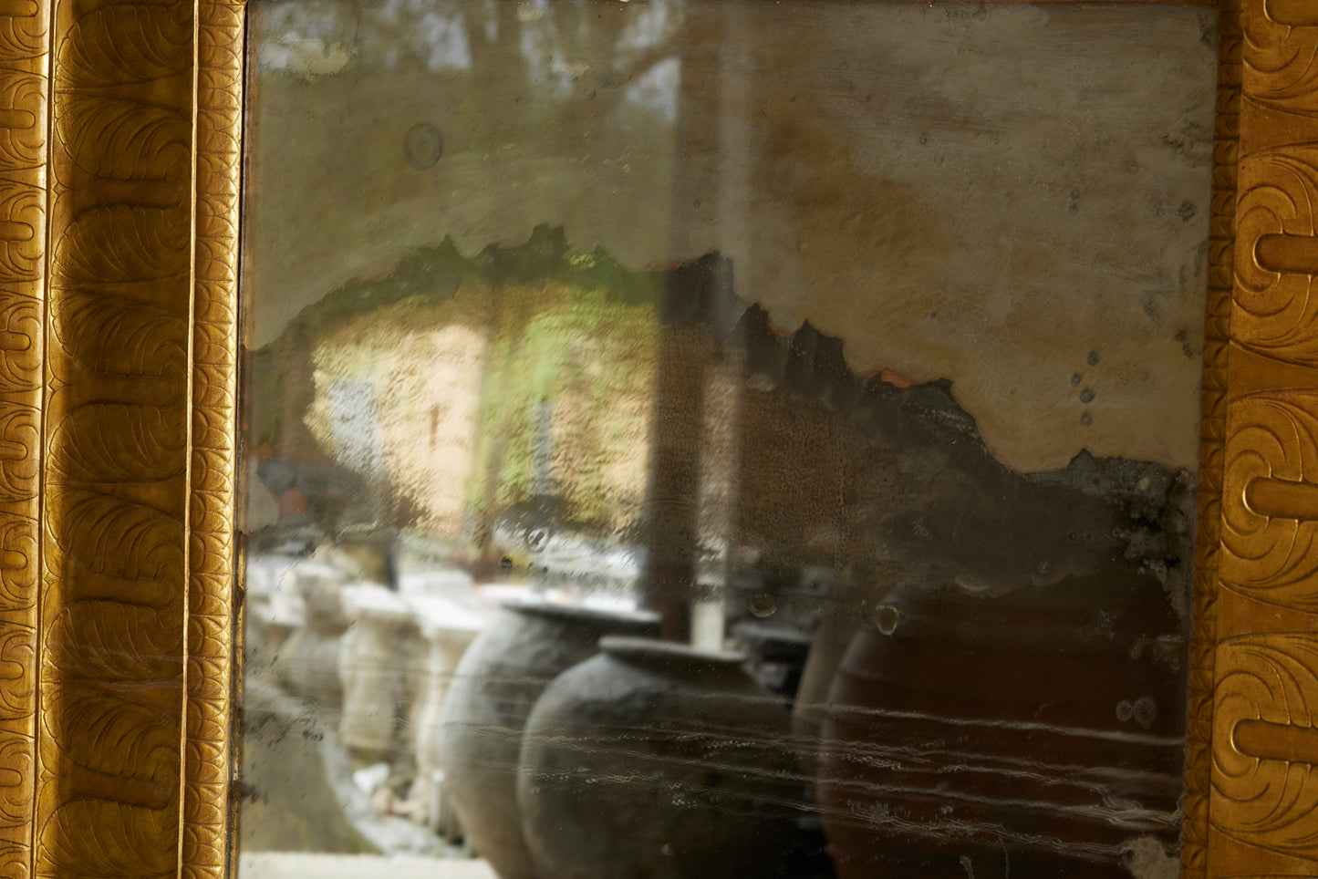 Large Egyptianesque 19th Century French Mirror with a Carved Wide Gilt Frame