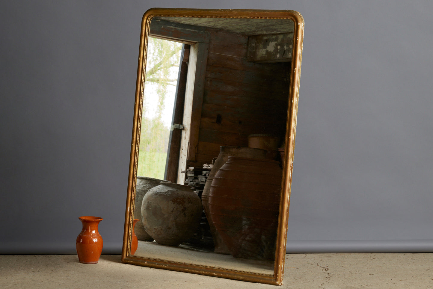 Mid 19th Century French Gilt Mirror with Round Shoulders on the Top