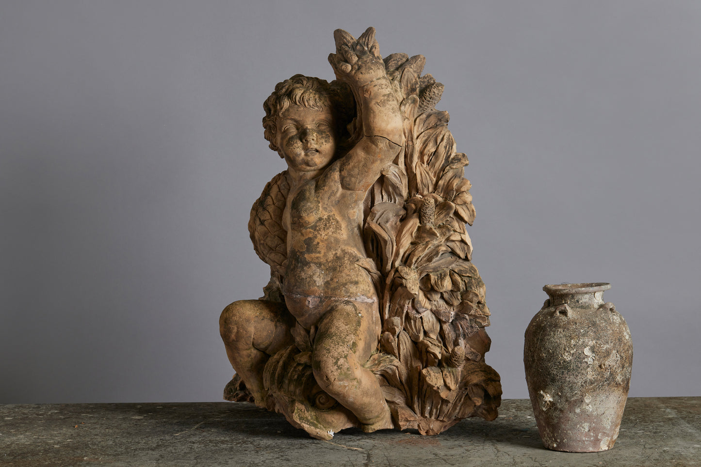 Mid to Late 18th Century Terra Cotta Fountainhead of a Putti Riding a Dolphin