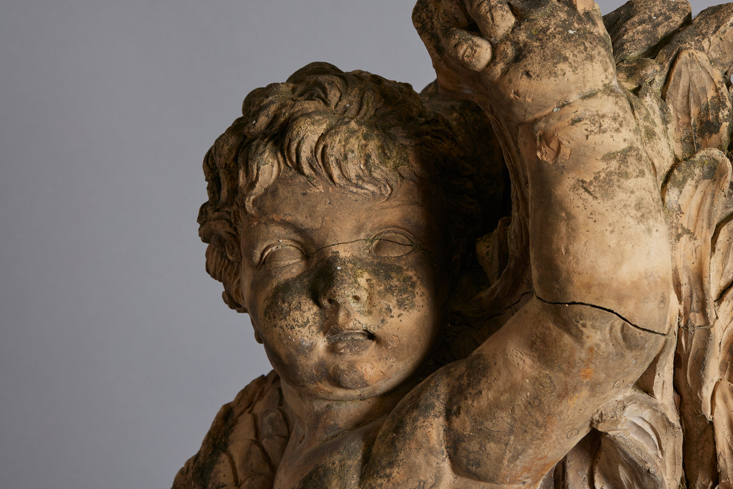 Mid to Late 18th Century Terra Cotta Fountainhead of a Putti Riding a Dolphin