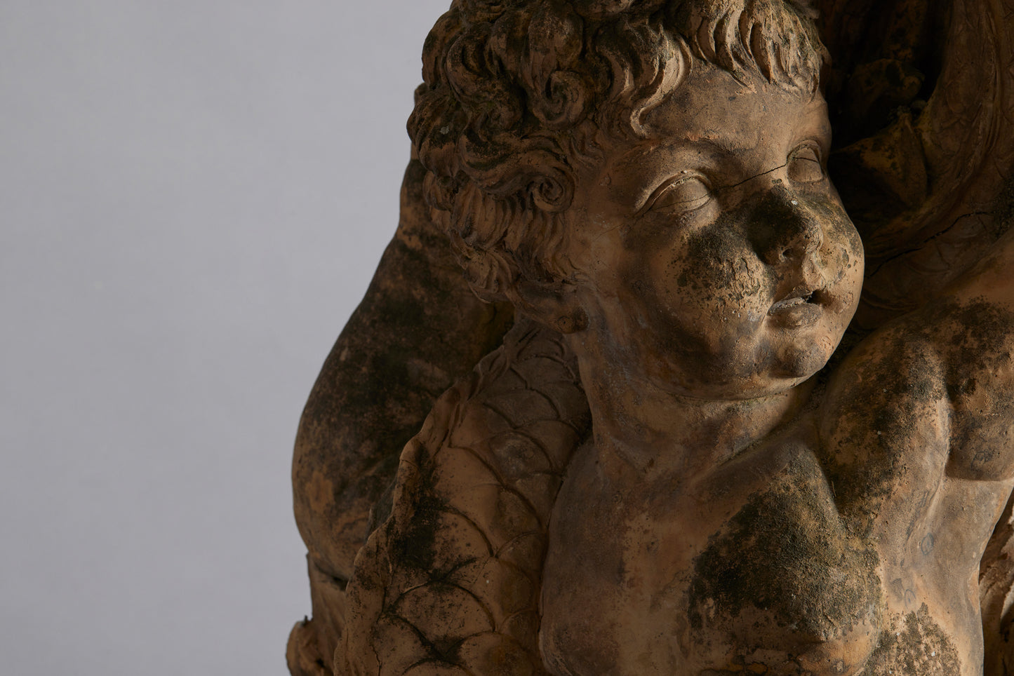 Mid to Late 18th Century Terra Cotta Fountainhead of a Putti Riding a Dolphin