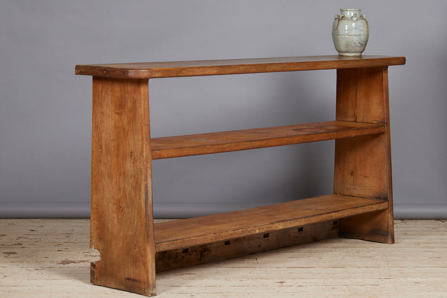 Beached Mid Century Modern French Bibliotec with Tapered Sides Thick Shelves and Champfered Corners