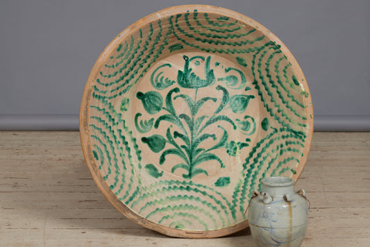 Late 18th Early 19th Cent. Spanish Lebrillo Bowl with a Green Fiance Decoration of a Tulip in the Center and Staple Repairs