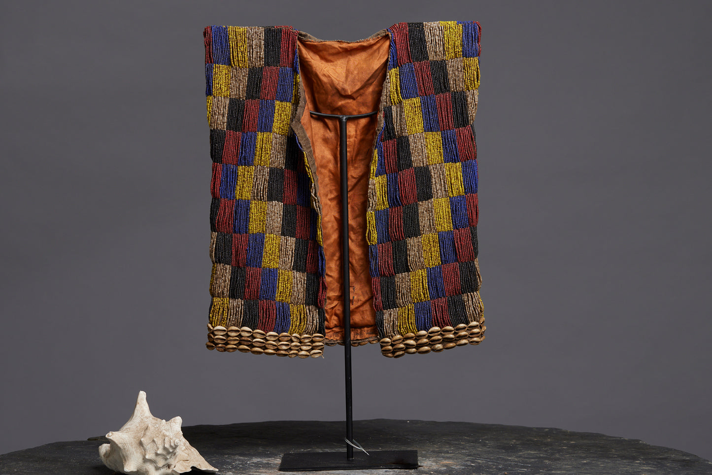 Rare Beadwork Shaman's Vest from Borneo Mounted on an Iron Base with a Cowrie Shell and Trade Beads