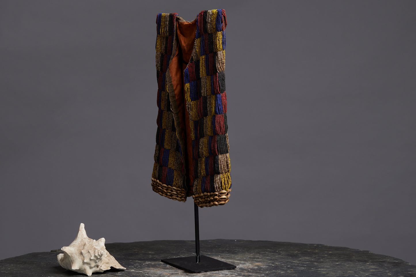 Rare Beadwork Shaman's Vest from Borneo Mounted on an Iron Base with a Cowrie Shell and Trade Beads