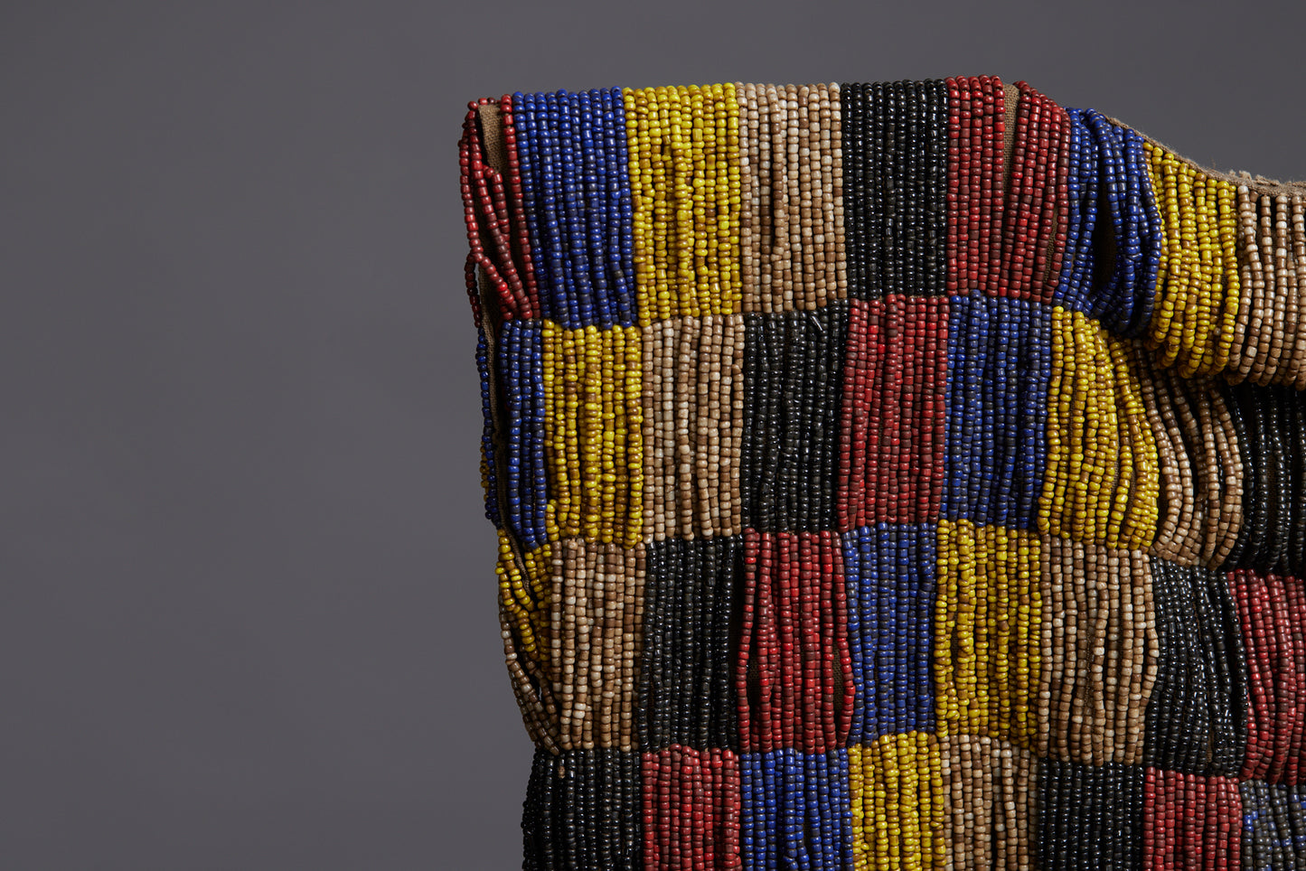 Rare Beadwork Shaman's Vest from Borneo Mounted on an Iron Base with a Cowrie Shell and Trade Beads