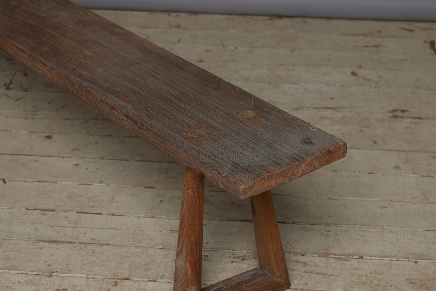 A Wide Top Splayed Leg Early Teak Bench with Beautiful Butterfly Repairs to the Top and a Round Tapered Leg