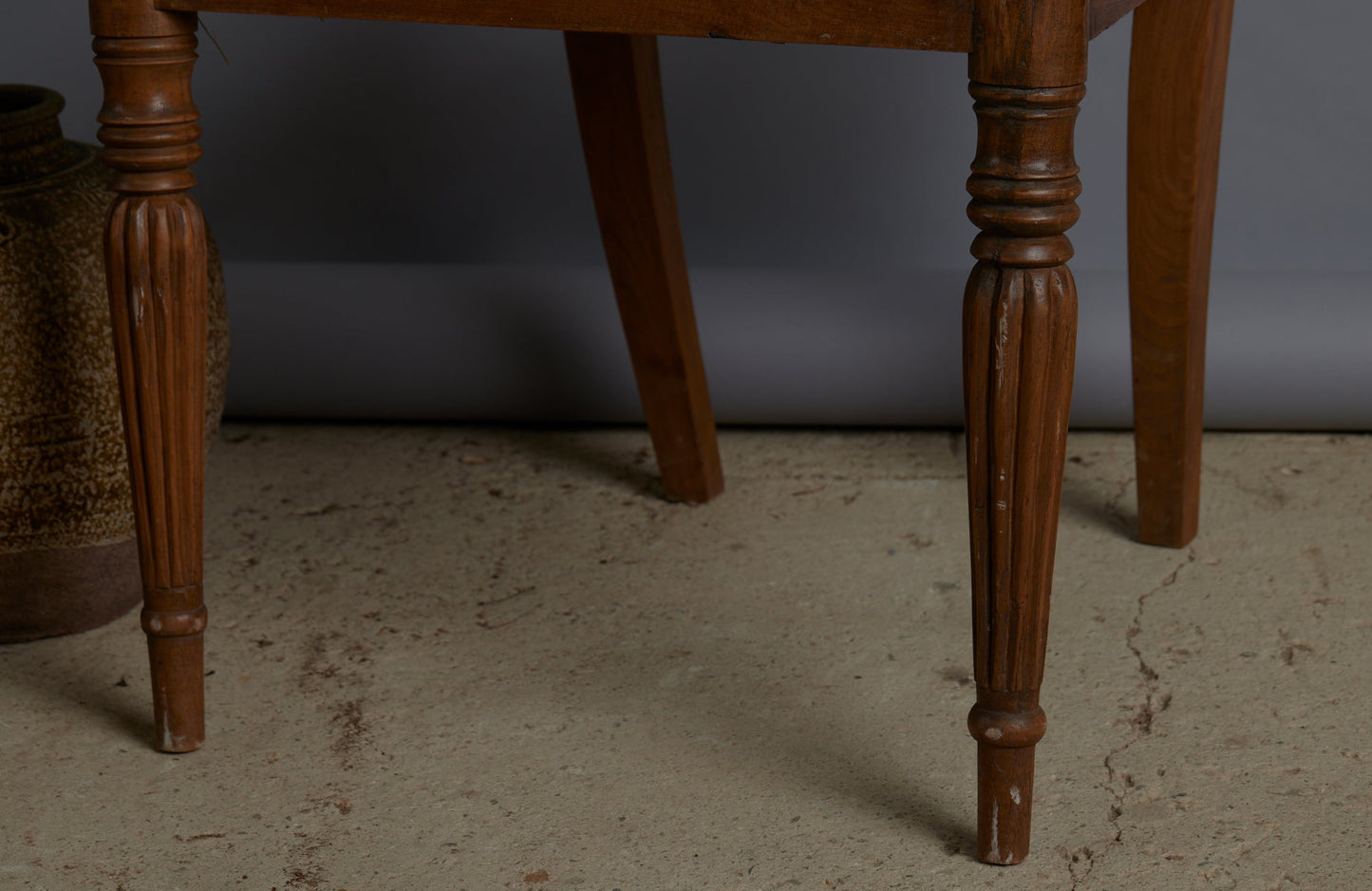 Pair of Light colored Teak Cane Seated Raffles Chairs from Java with a Delicate Gadrooned Legs