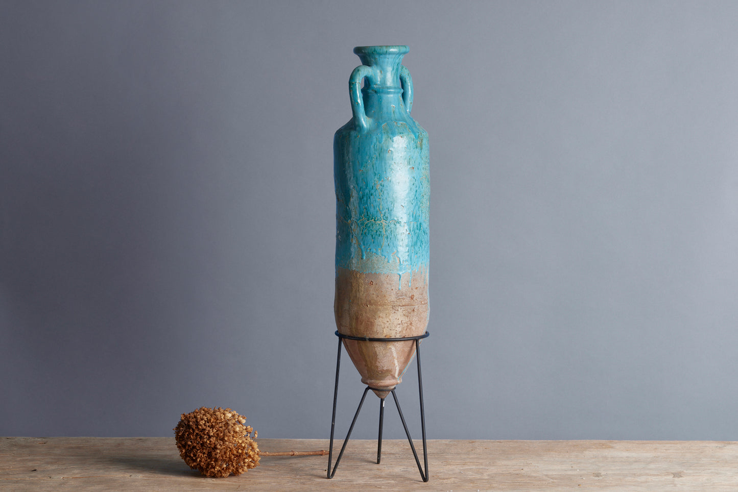 Blue Green Glaze Stoneware Amphora with a Tripod Iron Base from the Island of Borneo