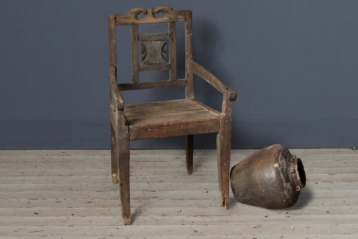 Small Primitive Teak Arm Chair with Crested Back